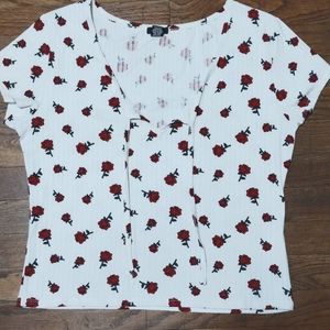 White tank top, red roses and two laces in the front; from rue21